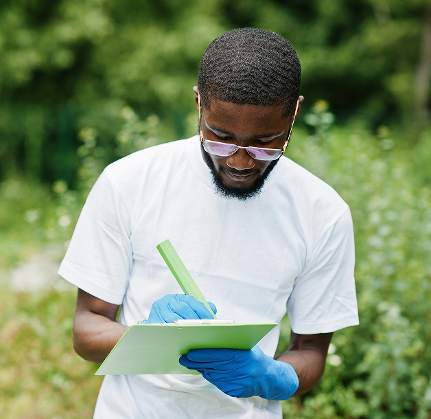 Farmer taking notes in the field